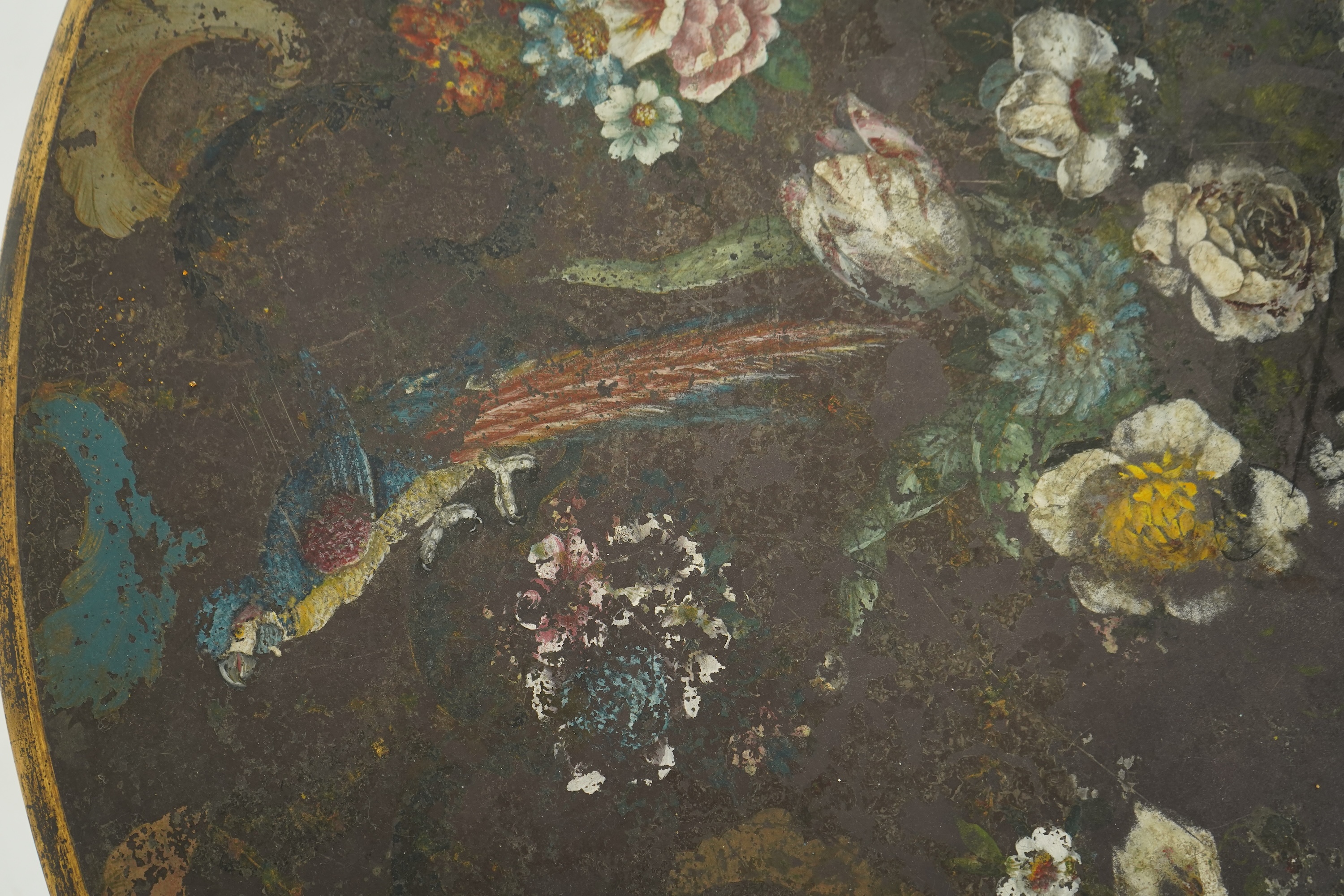 A George IV parcel gilt mahogany circular slate top centre table